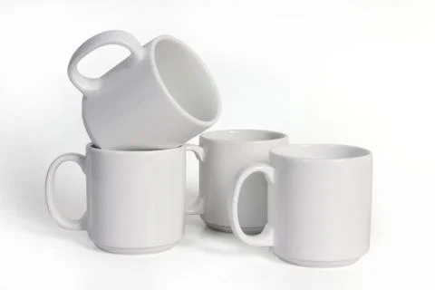 Four Ceramic Cups Isolated on White Background, Side View Stock Photos