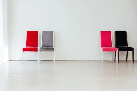 Four chairs in the interior of an empty white room Stock Photos