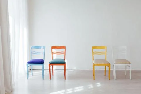 Four chairs in the interior of an empty white room 스톡 사진