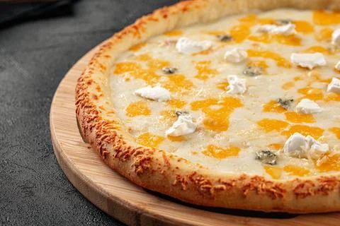 Four cheese pizza with cheddar and gorgonzola Stock Photos