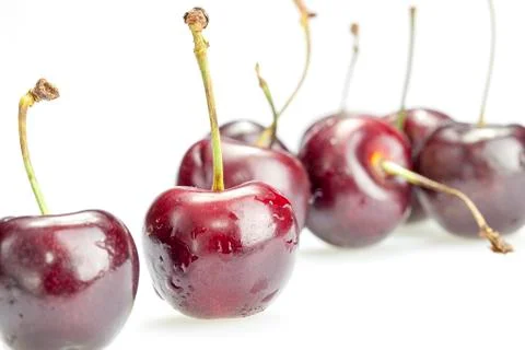 Four cherry berries isolated on white background Stock Photos