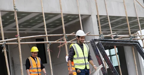 Four civil engineers leave the building. Stock Footage 194771356