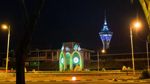 Four Clocks Featuring Arabic Numerals on a Roundabout in Alor Setar. Menara at Stock Footage 66260888