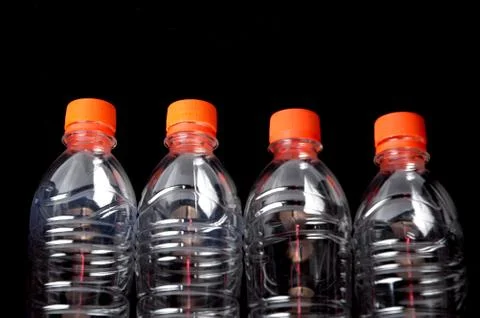 Four closed plastic bottles Stock Photos