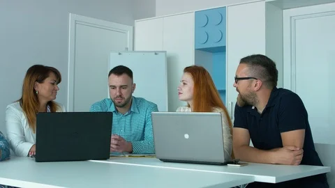 Four co-workers at work Video stock 93871029