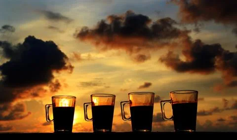 FOUR COFFEE AT SUNSET Stock Photos