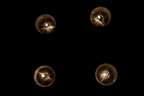 Four cold candle flames in darkness Stock Photos