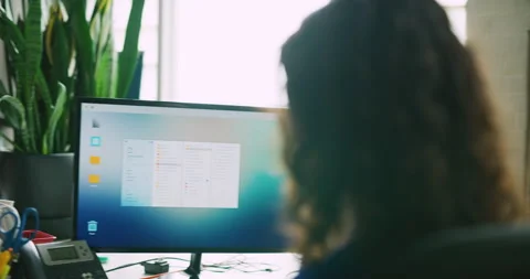Four collaborative female employees working in front of computers talking in off Video stock 199461033
