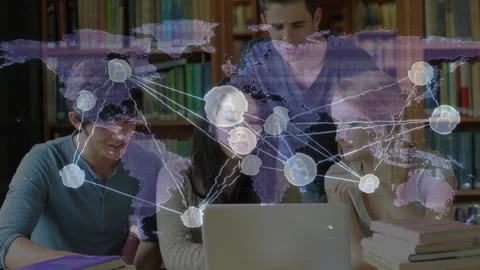 Four collaborators focusing on laptop screen, initiating pulsing world map Stock Footage 327642134