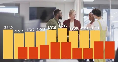 Four colleagues discussing live data trends in open-plan office, with digital Stock Photos