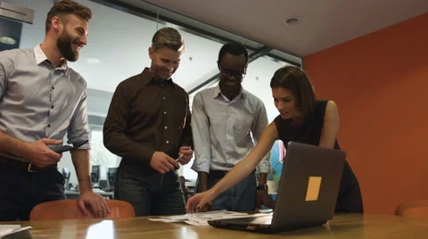Four colleagues talking about their success in tender Stock Footage 68348642