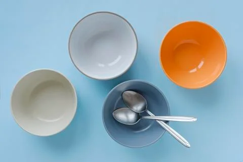 Four colored clean empty ceramic bowls Foto stock