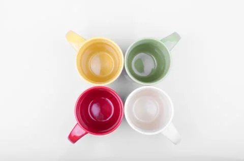 Four colored cups Stock Photos