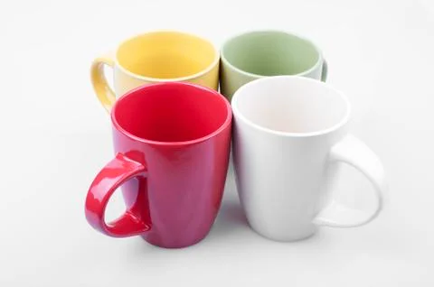 Four colored cups Stock Photos
