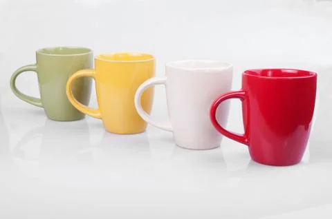 Four colored cups Stock Photos