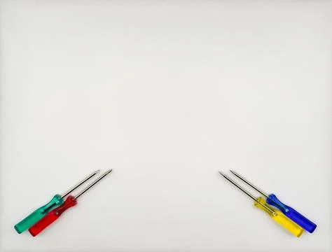 Four colored screwdrivers with plastic handles blue red green yellow left bottom Stock Photos