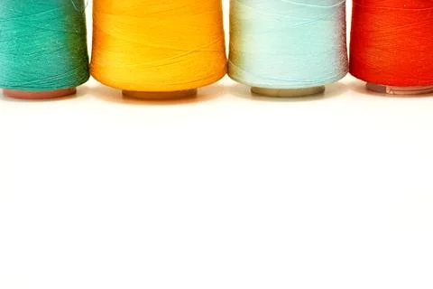 Four colored spools of thread.Tailoring supplies 스톡 사진