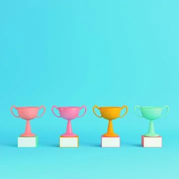 Four colorful trophy cups on bright blue background in pastel colors. Minim.. Stock Illustration