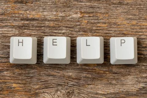 Four computer keyboard keys arranged to spell HELP word Stock Photos