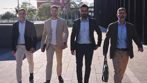 Four confident Hispanic, Middle Eastern and Indian businessmen walking in the Stock Footage 306659013