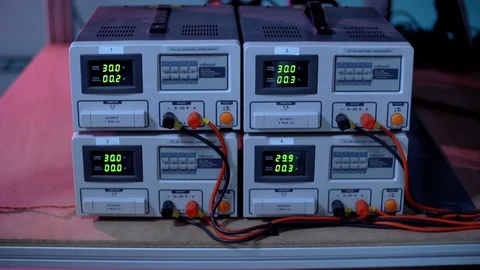 Four Connected Power Supply Machines With Changing Numbers Stock Footage 129398994