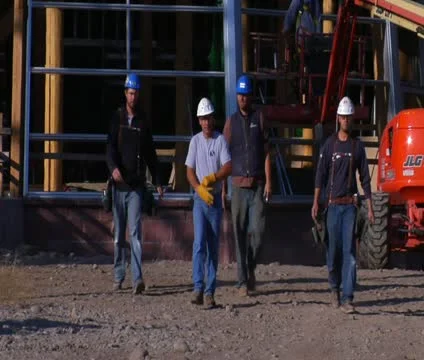 Four construction workers walked toward camera Stock Footage 21559290