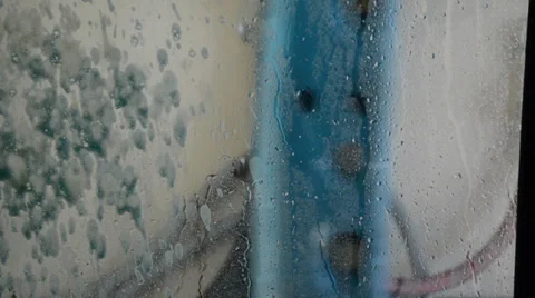 Four cuts of water running down the front windshield textures by carwash machine Video stock 34633453