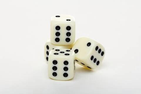 Four dice on a white background. Stock Photos