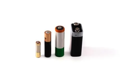 Four different batteries vertically Stock Photos