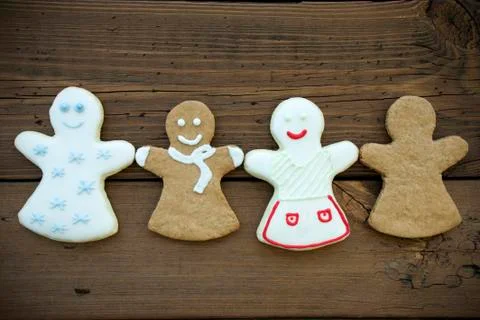 Four Different Happy Ginger Bread Woman on Wooden Background Stock Photos