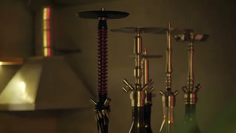 Four different hookahs are on the table in the lounge bar. Stock Footage 96409998