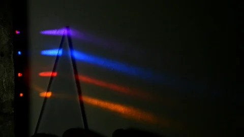 Four different light beams are refracted in  triangular prisms Stock Footage 123651350