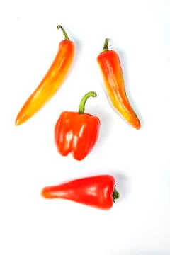 Four different red peppers Stock Photos
