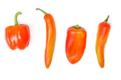 Four different red peppers Stock Photos