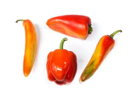 Four different red peppers Stock Photos