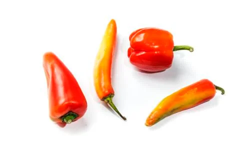 Four different red peppers Stock Photos