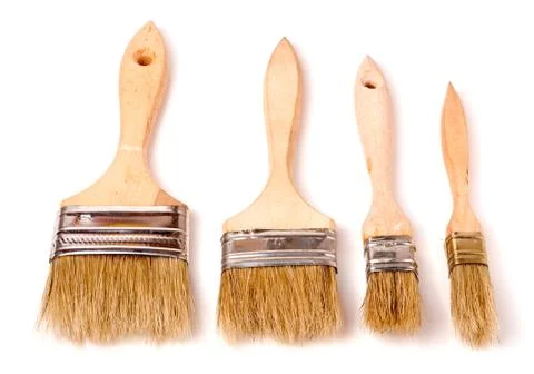 Four different size paint brushes isolated on white background Stock Photos