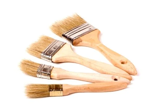 Four different size paint brushes isolated on white background Stock Photos