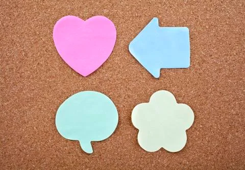 Four Different Sticky Notes on a Notice Board Stock Photos