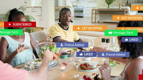 Four diners passing salad, play icon popping social-media engagement alerts Stock Footage 333975818