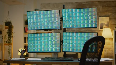 Four displays presenting financial data of stock market Stock Footage 127958996