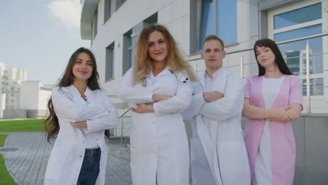 Four doctors in the background of the clinic Stock Footage 224057686