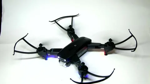 The four drone's propellers spin, it takes off and then crashes and stops Stock Footage 342256846