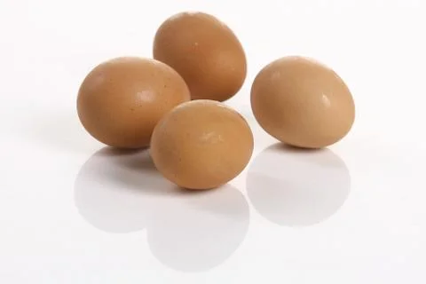 Four eggs isolated on white background Fotos de archivo