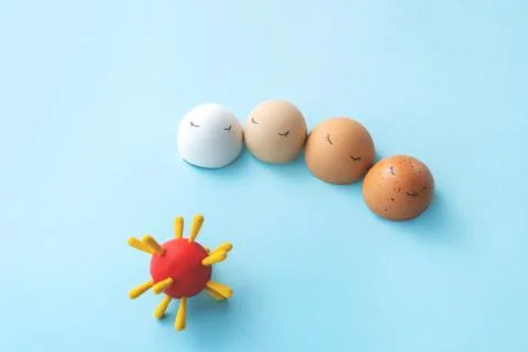 Four eggs with model of virus Stock Photos