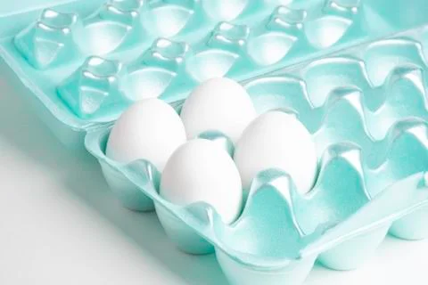 Four Eggs On A Styrofoam Tray Stock Photos