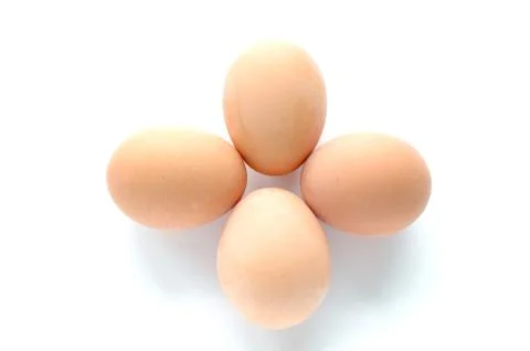 Four eggs on white background Stock Photos
