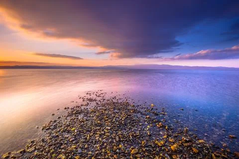Four elements water earth, air and fire combined in a sunrise at the medite.. Stock Photos