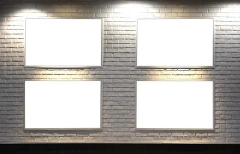 Four empty picture frames on the wall Fotos de archivo