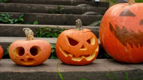 Four empty pumpkins with carved faces Stock Footage 160809457